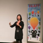 Woman speaking to the audience at PAAFF 2015