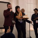 Rob Buscher and Quynh-Mai Nguyen holding a cake at PAAFF 2019