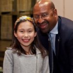 Mayor Michael Nutter poses with a young attendee at PAAFF 2011