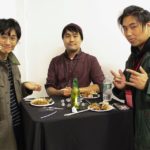 Yōsuke Araki, Brett Kodama, and Tristan Hsu eating at the closing night reception