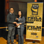 Former Festival Director Joe Kim accepting the Founder's Award from Festival Director Phuong Nguyen