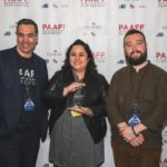Cecilia Mejia holding her trophy for Best Narrative Feature with Michael Wingate-Jones and Rob Buscher at PAAFF 2019