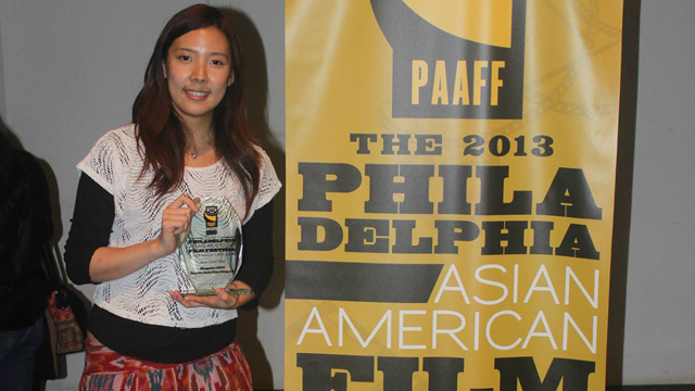 Photo of Doris Chia-Ching Lin holding her Best Short Film award trophy for Maquette 1:1000