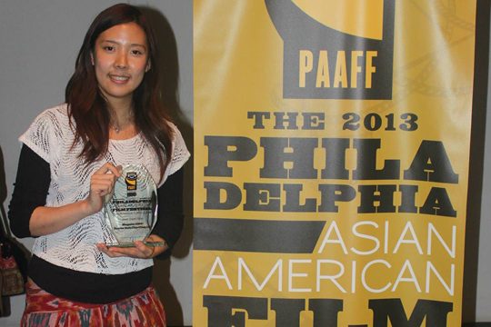 Photo of Doris Chia-Ching Lin holding her Best Short Film award trophy for Maquette 1:1000